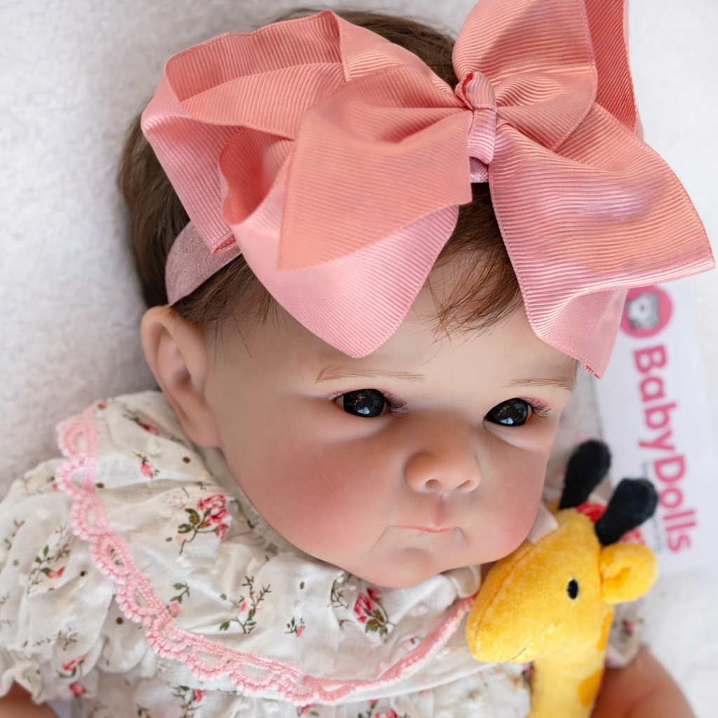 hand-painted vinyl reborn doll wearing a teddy bear hat